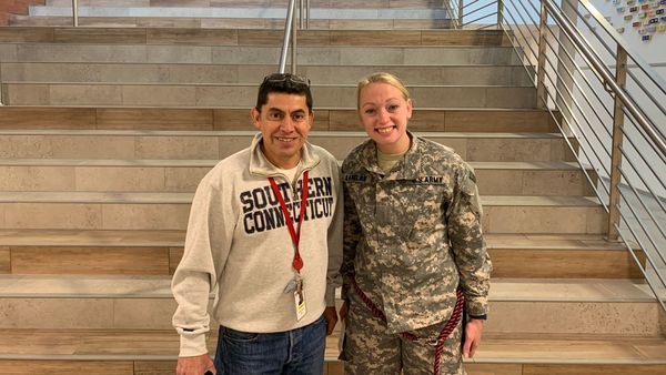 two veterans/staff smiling