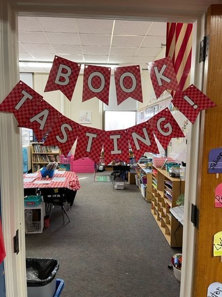 hand made "book tasting!" sign on a classroom door